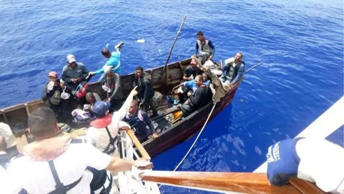 Moment Carnival Cruise Line ship rescues 27 migrants stranded in tiny wooden dinghy 20 miles off the coast of Cuba [Video]