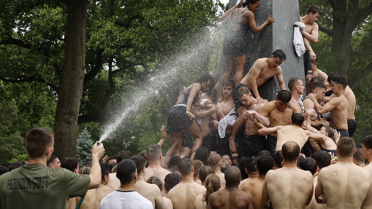 US Naval Academy ritual Herndon Monument Climb leaves Class of 2027 plebes covered in Crisco as their instructors take to them with the water hose [Video]