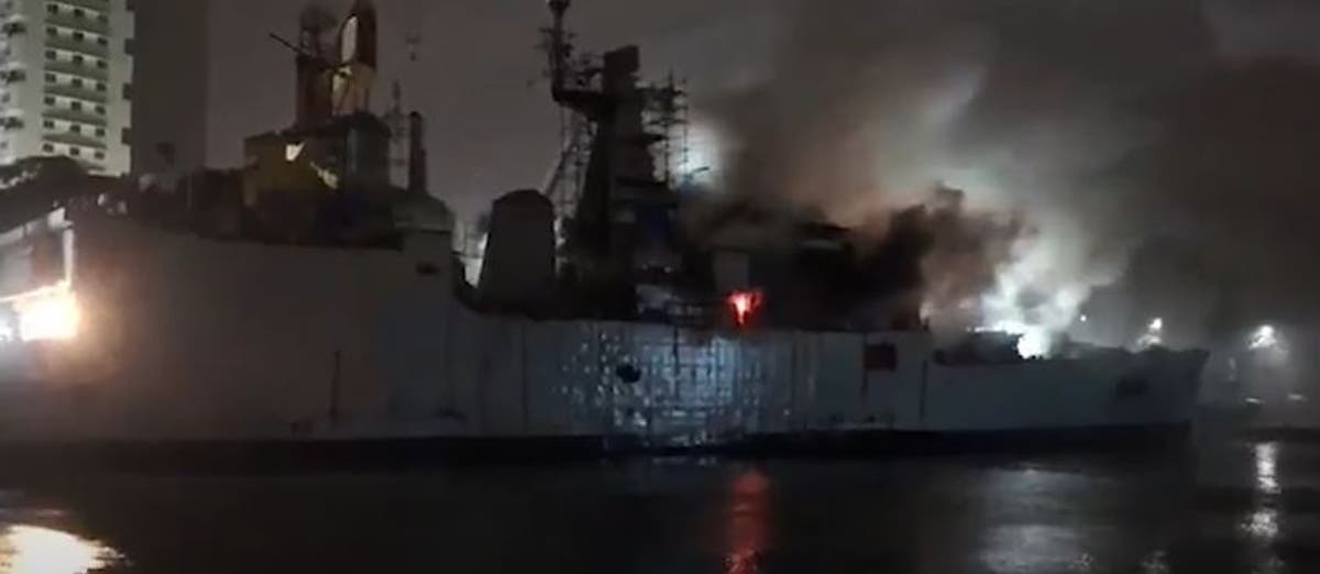 Indian frigate left floating on its side after fire breaks out during repairs [Video]