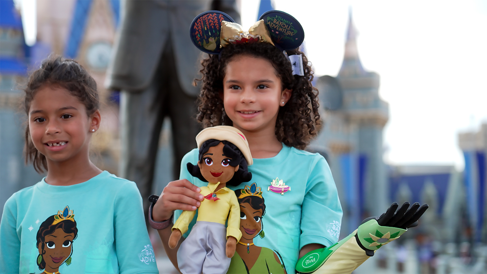 Girl with limb difference surprised with bionic arm cover inspired by Princess Tiana [Video]